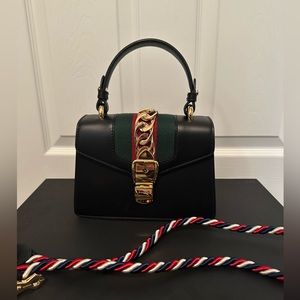 Brand new never worn Gucci 100% authentic 

Calfskin Mini Sylvie Top Handle Bag